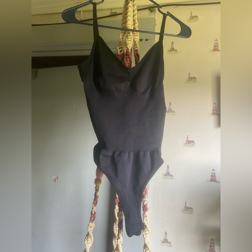 NWT Backless black bodysuit size small/medium